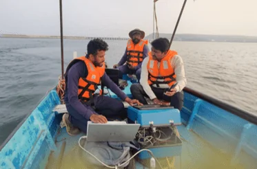 Survey team on a reservoir